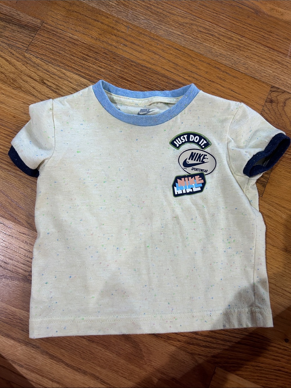 Nike Kids Cream Tee with Blue Trim and Navy Sleeve Accents